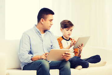 Image showing father and son with tablet pc at home