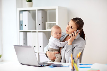 Image showing businesswoman with baby and smartphone at office