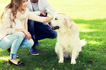 Image showing close up of couple with labrador dog outdoors