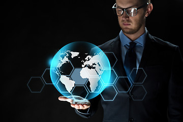 Image showing close up of businessman with earth projection