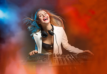 Image showing Beautiful blonde DJ girl on decks - the party,