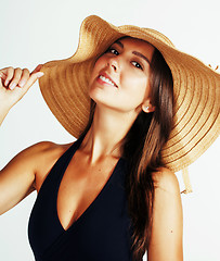 Image showing young pretty brunette woman wearing summer hat and swimsuit isol
