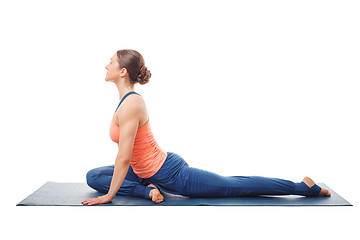 Image showing Woman doing yoga asana Eka pada kapotasana