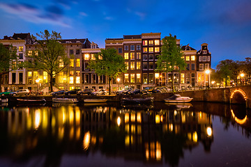 Image showing Amterdam canal, bridge and medieval houses in the evening