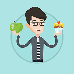 Image showing Man choosing between apple and cupcake.