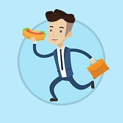 Image showing Businessman eating hot dog on the run.