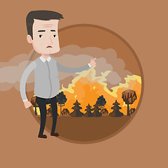 Image showing Man standing on background of forest fire.