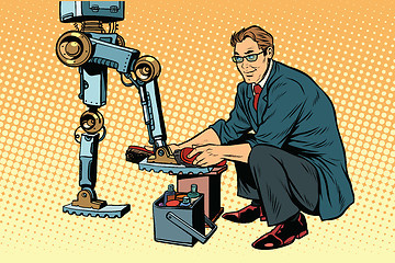 Image showing Businessman cleans shoes robot