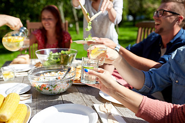 Image showing happy friends with drinks at summer garden party