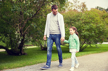 Image showing happy family walking in summer park