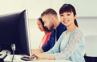 Image showing happy creative team or students working at office