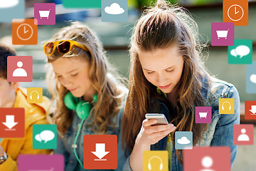 Image showing happy teenage friends with smartphones outdoors