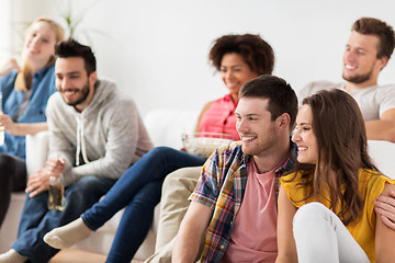 Image showing happy friends watching tv at home