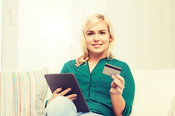 Image showing happy woman with tablet pc and credit card