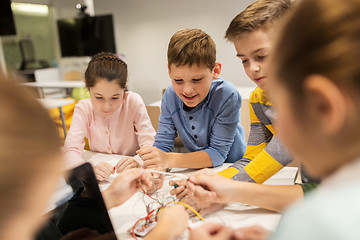 Image showing happy kids with invention kit at robotics school