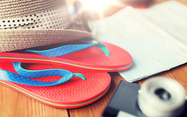 Image showing close up of travel map, flip-flops, hat and camera