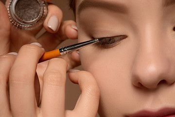 Image showing Beautiful female eyes with make-up and brush