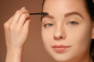 Image showing Beautiful female eyes with make-up and brush