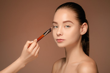 Image showing Beautiful female eyes with make-up and brush