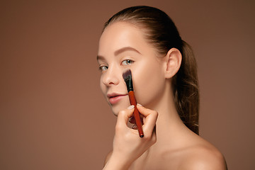 Image showing Beautiful female eyes with make-up and brush