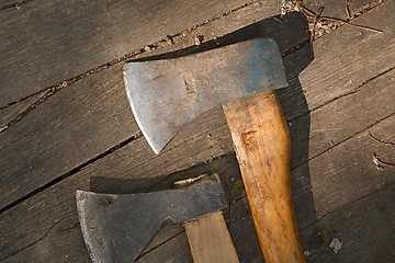 Image showing Two Axes on the ground