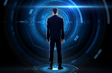 Image showing businessman from back with virtual projection