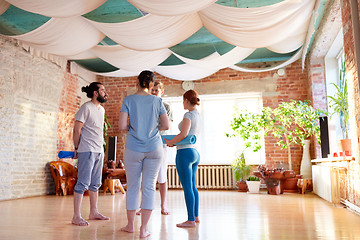 Image showing group of people with mats at yoga studio or gym