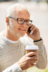 Image showing happy senior man calling on smartphone in city