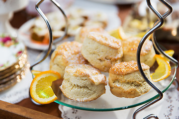 Image showing close up of sweet sugared buns on stand