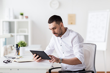 Image showing businessman with tablet pc at office