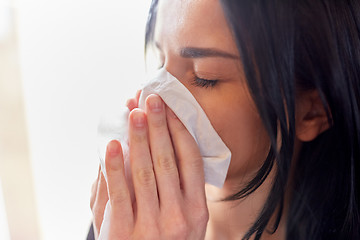 Image showing close up of woman with wipe blowing nose or crying