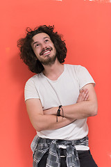 Image showing young man with funny hair over color background