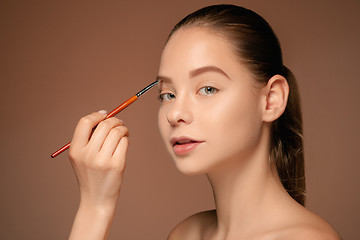 Image showing Beautiful female eyes with make-up and brush