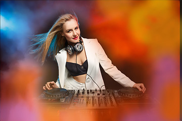 Image showing Beautiful blonde DJ girl on decks - the party,