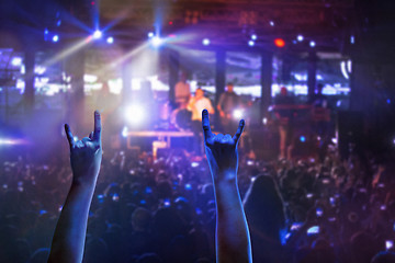 Image showing The silhouettes of concert crowd in front of bright stage lights