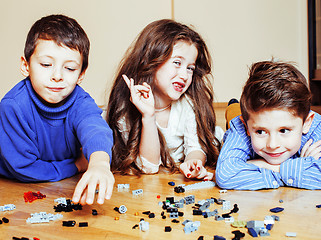 Image showing funny cute children playing toys at home, boys and girl smiling,