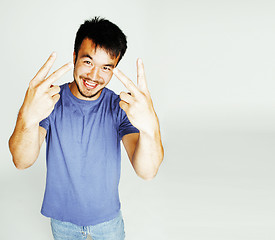 Image showing young cute asian man on white background gesturing emotional, po