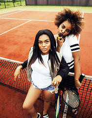 Image showing young pretty girlfriends hanging on tennis court, fashion stylis