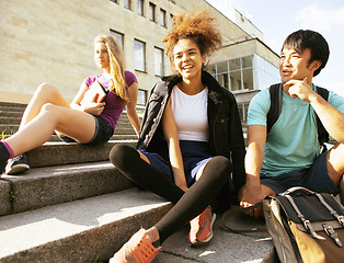 Image showing cute group teenages at the building of university with books huggings