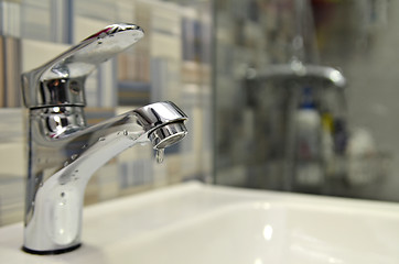 Image showing Bathroom tap leaking water drops