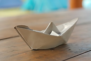 Image showing Paper boat on a table