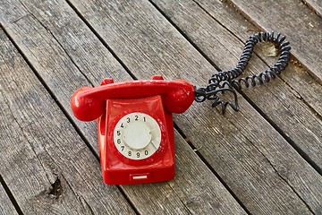 Image showing Old telephone on wooden boards