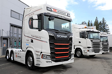 Image showing New White Scania Trucks on Asphalt Yard