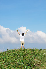 Image showing Meeting of the sky. The man on high mountain with the hands lift