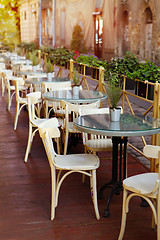 Image showing empty little white tables of cafeteria