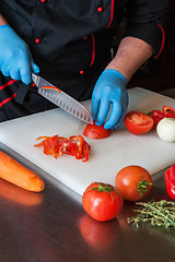 Image showing Chef cutting vegetables