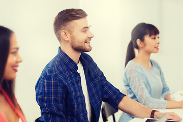 Image showing happy creative team or students working at office