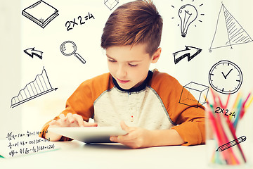 Image showing close up of boy with tablet pc computer at home