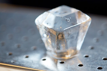 Image showing hand-cut ice cube at bar