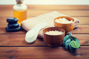 Image showing close up of salt, massage oil and bath stuff